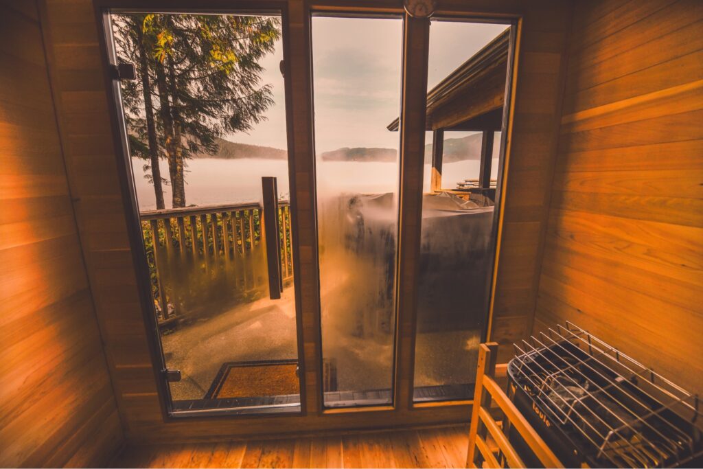 A sauna room with a deck and a window